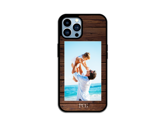 Example of a custom phone case for iPhone featuring a heartwarming photo of a father and daughter, showcasing personalization options with a wood pattern background.